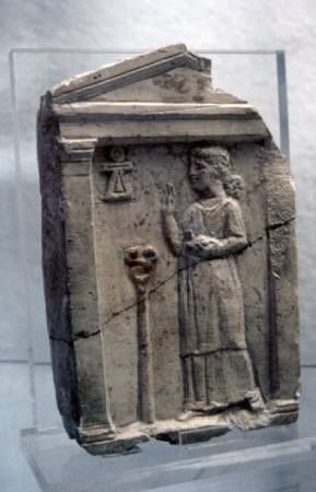 Votive steles from Carthage depicting priests or suppliants with their right hands raised in blessin