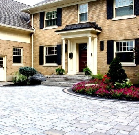Exterior BrickExample Of A Large Classic Beige Two-story Brick Exterior Home Design With A Mixed Material
