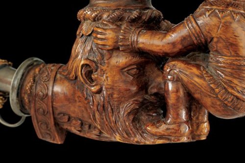 A wonderfully carved tobacco pipe originating from 19th century Germany.