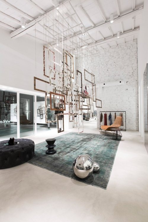 {Love the contrast of the clean simple walls, with the beautifully lit painted brick and stone.} via