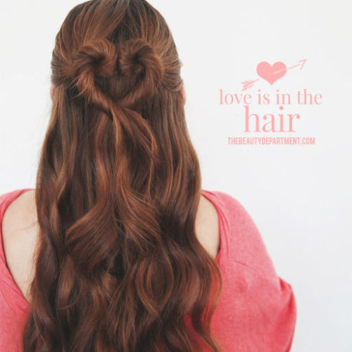 lovelydyedlocks:  You will need: bobby pins, 2 small ponytail elastics, a comb. Start by adding a little wave to your hair. Wand waves are great for this! Here we used this wand by TiGi which is only around ฮ! Next put your hair half up, separating