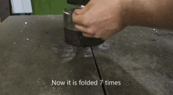 Watch: A Hydraulic Press Causes A Piece Paper Folded 7 Times To Explode Into Pieces.