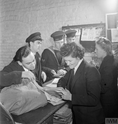 WRNS with the Fleet Mail (England, November 1944):Just visible through the grid of sorting compartme