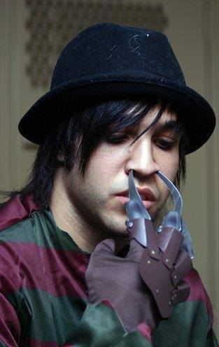 underthe-corktree:  there is literally a picture of pete wentz doing anything riding a clothing rack?  being hannibal lectur at a fashion show?  freddy kruger with a fedora?  laying with pandas?            