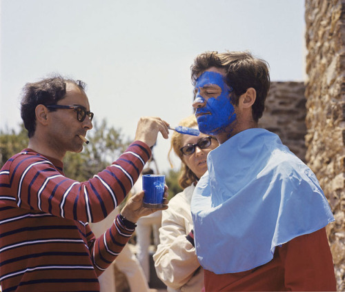 thesongremainsthesame: Jean-Paul Belmondo getting his face painted blue by director Jean-Luc Go