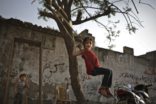 Palestinian refugee children play in front of their family house in Jabaliya Refugee camp, in north 