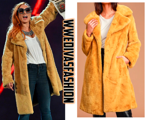 Becky Lynch was seen wearing the Avec Les Filles Grand Ambition Faux Fur Long Coat in Mustard Yellow