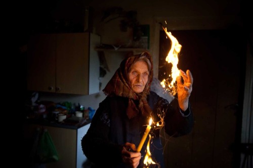 global-musings:Anna Bondaruk a Szeptunka from the village of Rutka prays at her home. Bondaruk claim