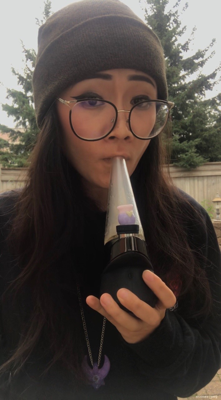 Asian Girl Smoking Blunt With Chopsticks