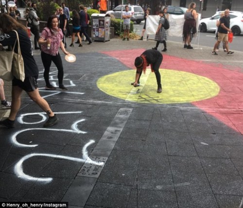 25 January 2017 - Indigenous activists painted a huge anti-colonial piece and burnt an Australian fl