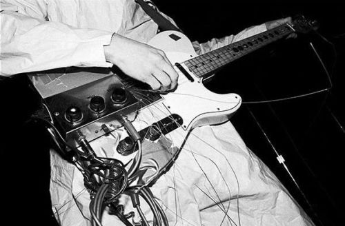 theunderestimator-2:   Mark Mothersbaugh performing with Devo in 1977, as captured by Ruby Ray.(via)