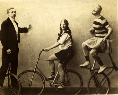 bibliophagist:  Fixies! Tall bikes! (Or at least a tall unicycle.)Real photo postcard (ca. 1910?), i