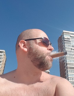 dutchbear74:  enjoying myself at Benidorm Beach Spain 😈 #cigar #dutchbear74