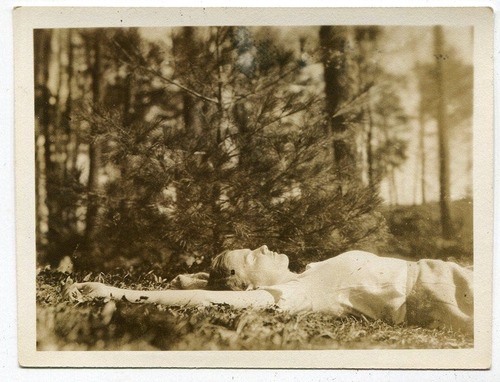 ehoradote: Woman stretches out by a pine tree