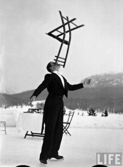 Alfred Eisenstaedt - Head Waiter Rene Breguet Balancing Chair On Chin At Ice Rink