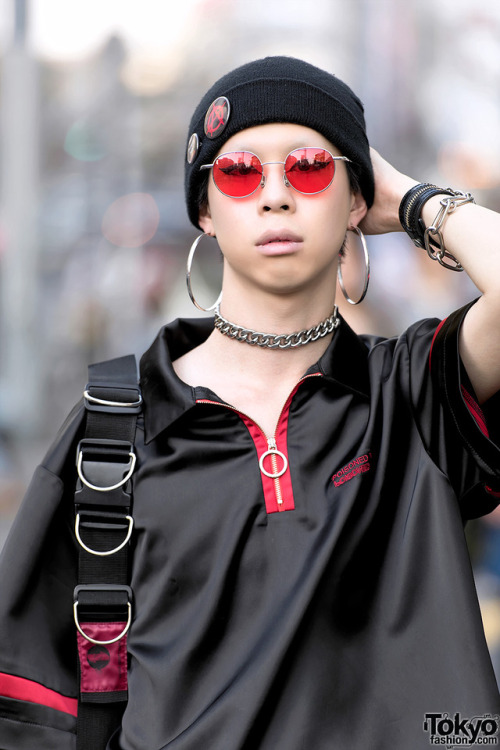 Cham - the director of the Tokyo streetwear brand BERCERK - on the street in Harajuku wearing an Ano