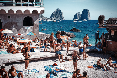 SUNBATHERS, CAPRI, ITALY BY ROBERT VOLTAIRE