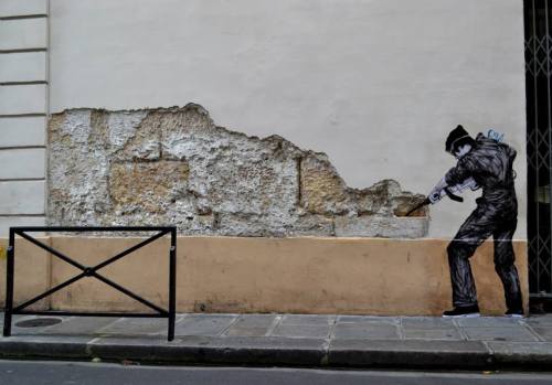 itsderandom:The French street artist known as Levalet, aka Charles Leval, works in Paris filling con