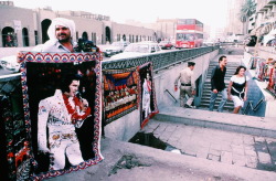 aliirq:  A vendor hawks a rug portrait of