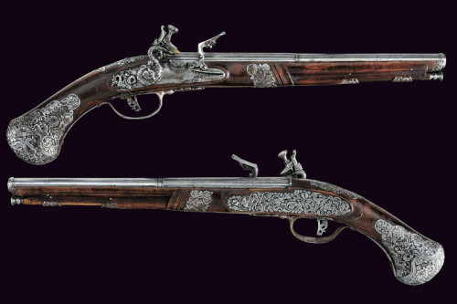 A pair of silver mounted flintlock pistols signed “Lazarino Cominazzo”. Originates from 