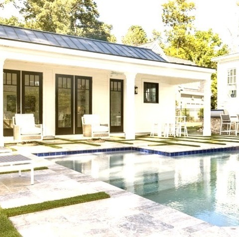 Pool House - PoolExample Of A Large Minimalist Backyard Stone And Custom-shaped Natural Pool House Design