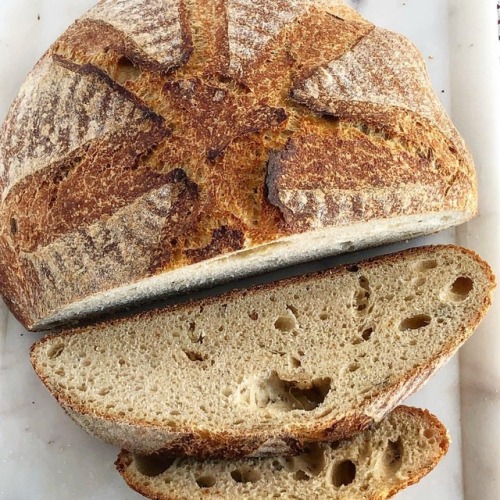 Yummy Roasted Garlic Rosemary bread. A bit denser than my other sourdoughs. Great flavor and it take