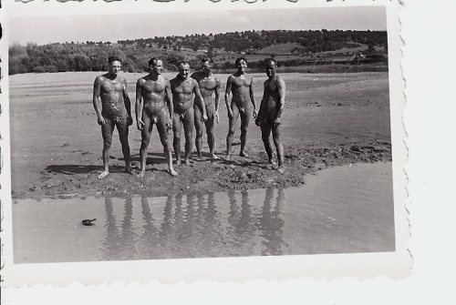 vintagemusclemen:  Soldiers wearing nothing but mud.