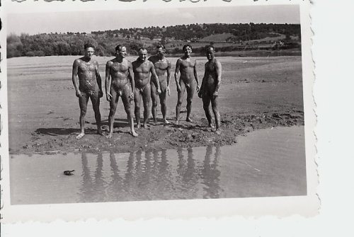 vintagemusclemen:Soldiers wearing nothing but mud. 