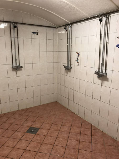 Men’s shower and bathroom at the Skydive Voss in Voss, Norway. It’s both a skydiving centre and host