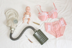 lonesnow:  things my loving boy got me for christmas: an old russian gas mask, a bonnie baby doll, pleasure state lingerie, a winchester knife and a .50 cal casing with “my angel” engraved on it  