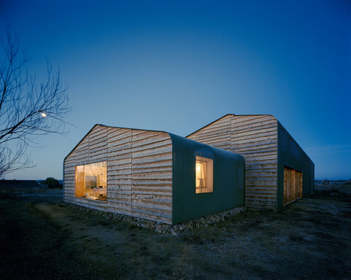 aros:  House with Built-In Window Nook and Interior Fire Pit