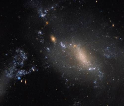 The Hubble Space Telescope observes the collision of two galaxies about 60 million light years into 