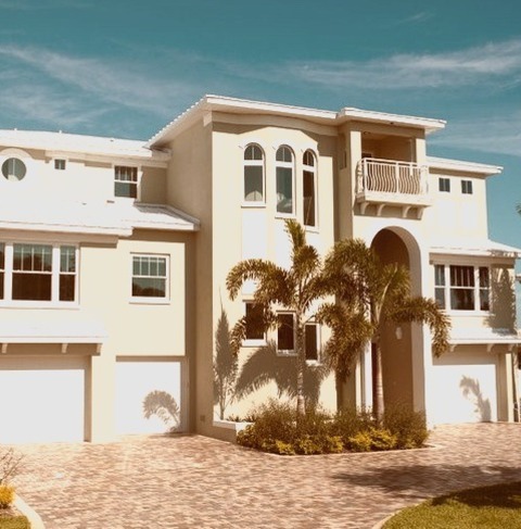 Concrete ExteriorExample Of A Huge Island Style Gray Three-story Concrete Exterior Home Design
