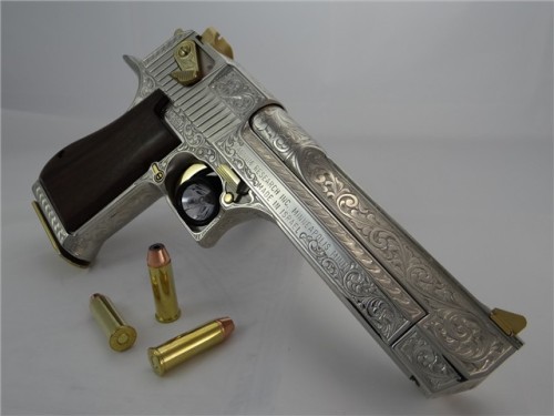 cavalier-renegade:  gunrunnerhell:  Desert Eagle Custom engraved Desert Eagle in .44 Magnum, it is accented with 24K gold on several parts throughout the gun. The engraver, Santiago Leis, is one of the most famous engravers in the gun community. It’s