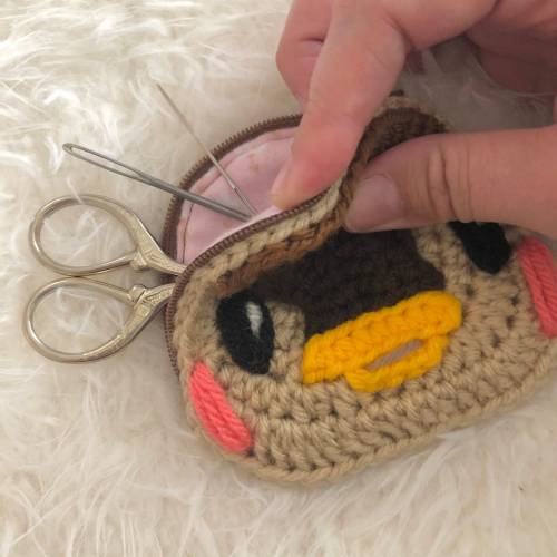 retrogamingblog2: Crochet Animal Crossing Pouches made by SunnyStitchery [ID: There are 5 images fe