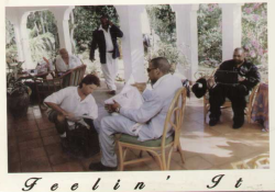 aintnojigga:Jaÿ-Z getting his shoes shined on the set of Feelin’ It, photographed by Arnold Turner in Jamaica in 1997. Sidenote: Spot Dame and Biggs chillin’