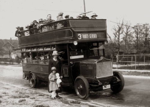 Agnes Sheldon and her daughter Mary in front of a Milwaukee Transit double-decker bus, Shorewood, Wi