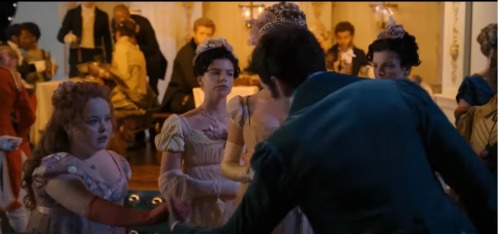 Colin Bridgerton taking Penelope's hand in front of Cressida in S1