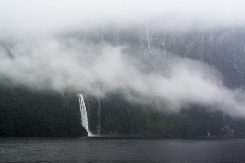 Clouds and waterfalls at Milford Sound.Milford Sound, Fiordland, South Island, New Zealand