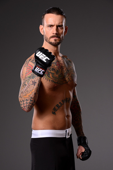 thepunknation:UFC Photoshoot Part Two‘DALLAS, TX - MARCH 13:  Phil ‘CM Punk’ Brooks poses for a photo during a UFC photo session at the Hilton Anatole Hotel on March 13, 2015 in Dallas, Texas. (Photo by Mike Roach/Zuffa LLC/Zuffa LLC via Getty