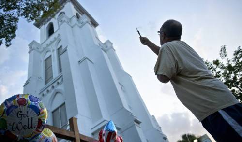 micdotcom:  Emotional photos show the first Sunday service at the Emanuel AME Church after the shootingThe church was packed to capacity; the Associated Press reported parishioners were queued in long lines to get in. Police officers were on the scene