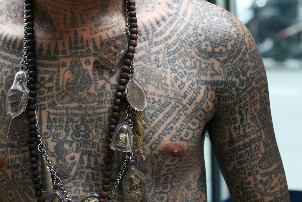 mortem-et-necromantia:  A man covered in traditional Sak Yant tattoos and various