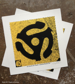 classicwaxxx:  Know what we like as much as vinyl? Art dedicated to vinyl! Here is Napkin Art Studios’ silk screen print tribute to the 45 adapter! Hand printed on French Madero Beach Speckletone paper, measures 7” x 7” and is a signed, open edition