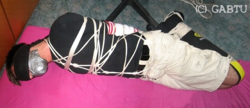 gabtu:Hogtied in wearing soccer socks (on arms AND legs) with quite a lot of rope. Yes he loved it - as you can see :)