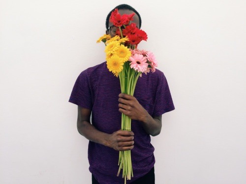 dynamicafrica:  In Conversation with Brandon Stanciell - The Man Who Loves Flowers.One of the first-ever photographs I came across involving a black man tenderly clutching flowers and gazing into  the lens of the camera was a self-portrait by Cameroonian