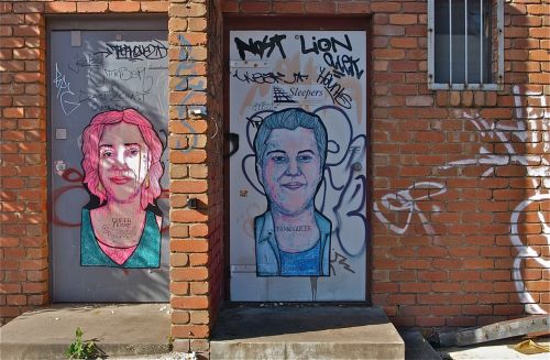 “Queer Love” pasted in Melbourne, Australia. Two portraits of a queer couple pasted side