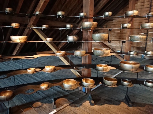 Ingrid Hu ‘Longplayer singing bowls display’. Trinity Buoy Wharf, Poplar, London, England 