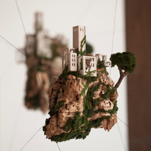 archatlas:  Miniature Houses on Cork Cliffs Float Inside Handmade Wooden Frames by Rosa de Jong  Designer Rosa de Jong produces micro homes that are built into the side of tiny cliffs constructed out of cork. Her miniature environments are covered in