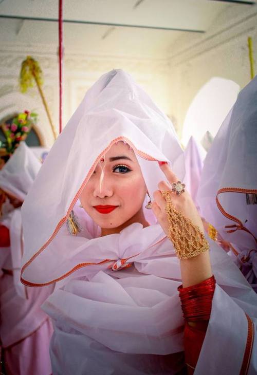 Hidden faces, Beautiful veiled woman protecting themselves from the colored powders, Holi Festival a