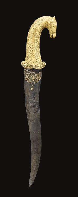 A Mughal carved ivory horse-head hilted dagger, India, 18th century.Sothebys, Arts of the Islamic Wo